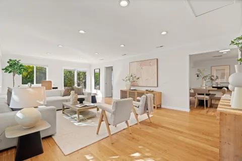 a living room with furniture and a table