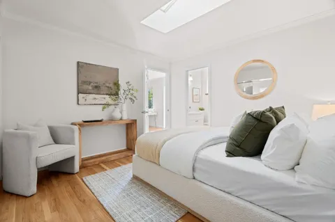 a bed room with a bed and a couch