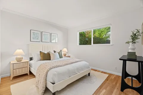 a bedroom with a bed and window