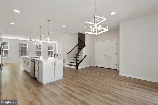 a view of an entryway with wooden floor
