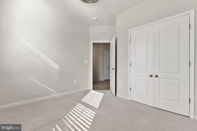 a view of a closet area with hallway