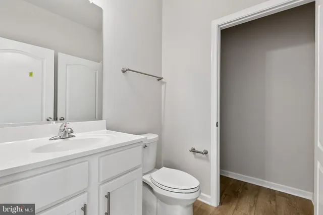 a bathroom with a sink toilet and vanity