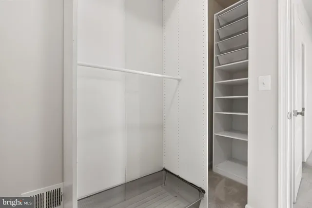 a view of an empty walk in closet