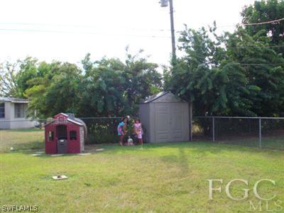 308 East Jersey Road Lehigh Acres, FL 33936 - Photo 8 of 10 a view of a backyard with trampoline