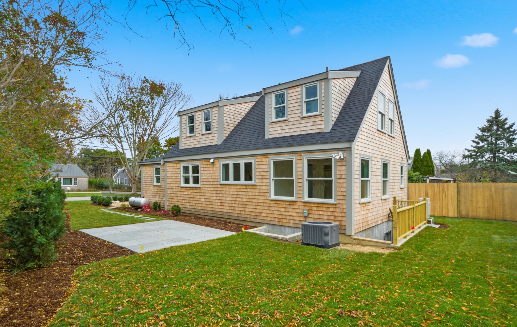 38 Hooper Farm Road Nantucket, MA 02554 - Photo 2 of 19 a front view of a house with a yard