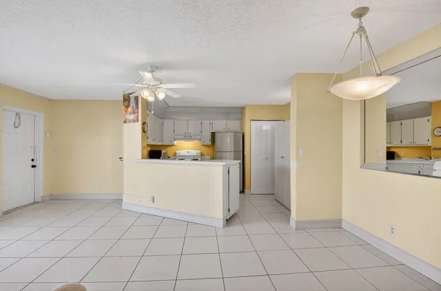a kitchen with a sink cabinets and window