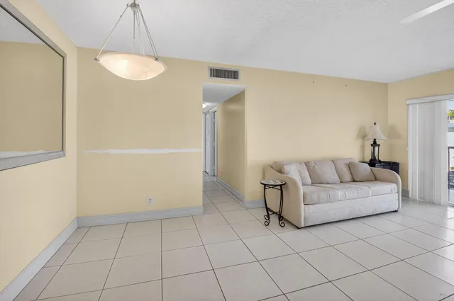 a living room with a couch and a table