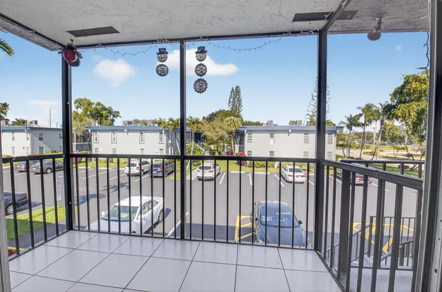 a view of a balcony with wooden floor