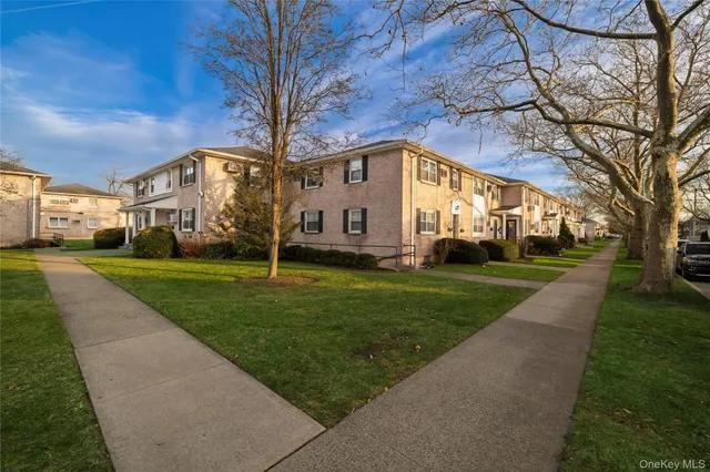 a view of a building with a yard