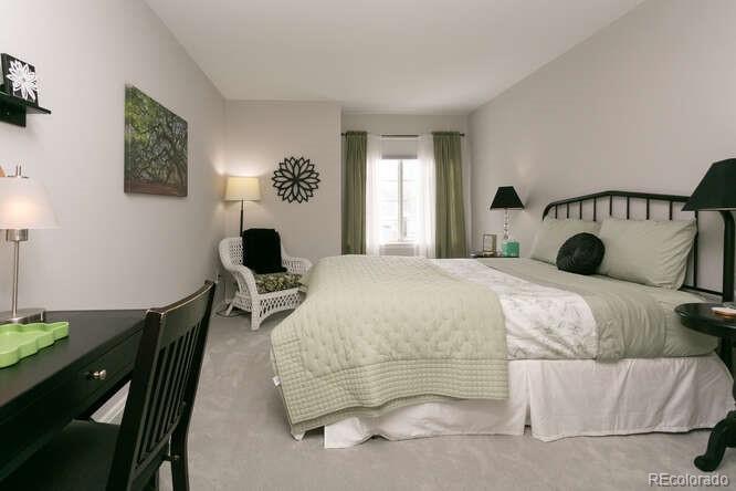 9772 Quay Loop Westminster, CO 80021 - Photo 20 of 36 a bedroom with a bed and window