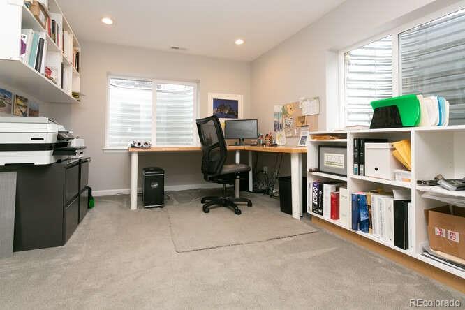 9772 Quay Loop Westminster, CO 80021 - Photo 29 of 36 a view of a workspace with furniture and a window