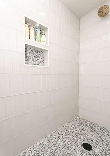 9772 Quay Loop Westminster, CO 80021 - Photo 31 of 36 a bathroom with a shower