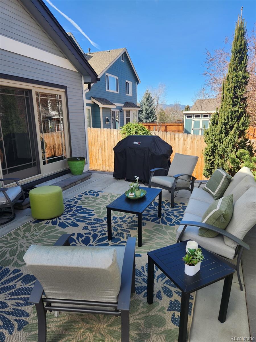 9772 Quay Loop Westminster, CO 80021 - Photo 33 of 36 a view of a lounge chairs in the patio