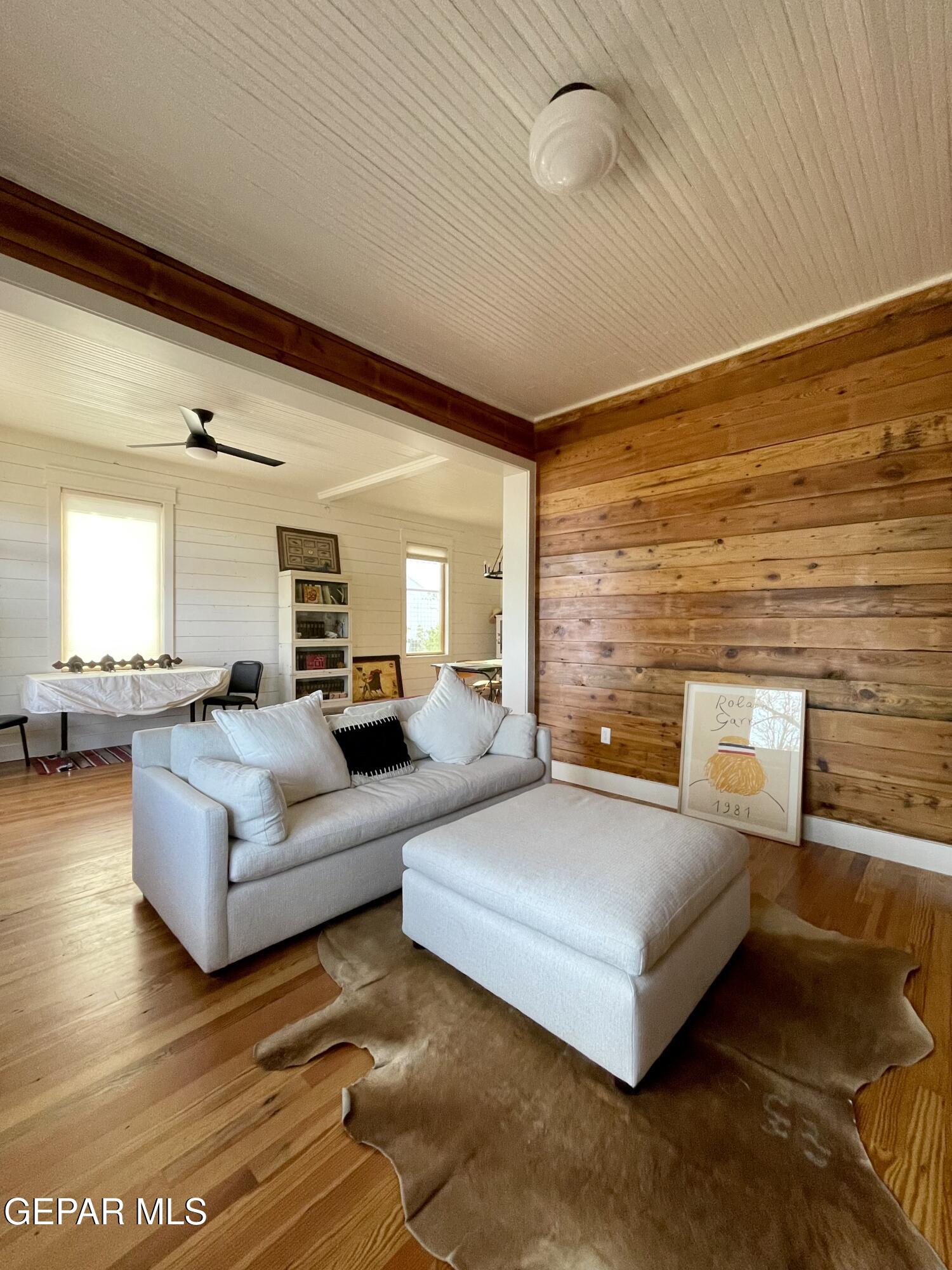 215 East Texas Street Marfa, TX 79843 - Photo 4 of 15 a bedroom with furniture and a large window