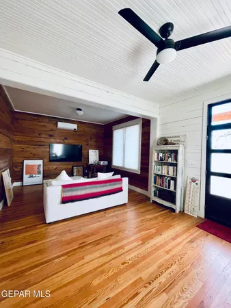 a bedroom with furniture and window