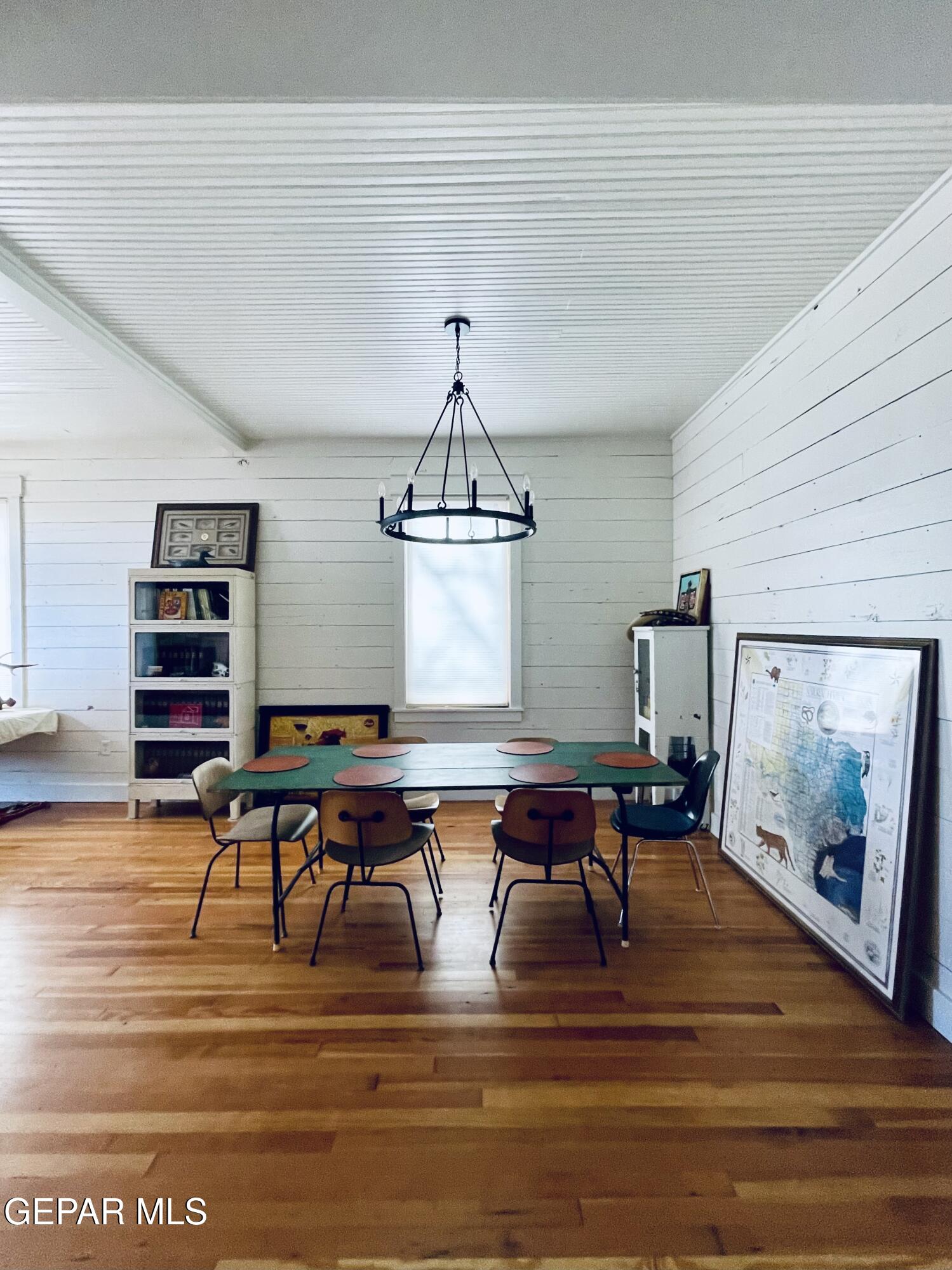 215 East Texas Street Marfa, TX 79843 - Photo 7 of 15 a view of a dining room with furniture wooden floor and a chandelier