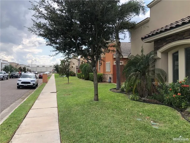 a view of a yard with cars