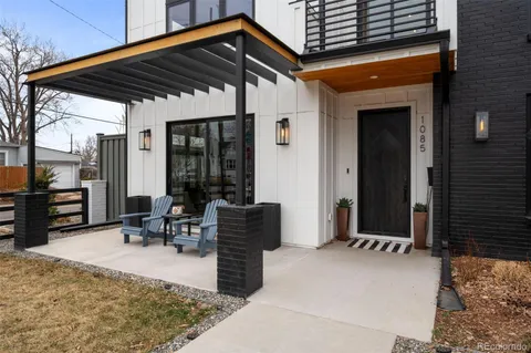 a patio with table and chairs