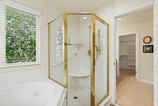 298 North Canyon Road Bountiful, UT 84010 - Photo 33 of 57 Corner glass-enclosed shower with gold-finish trim and integrated seating