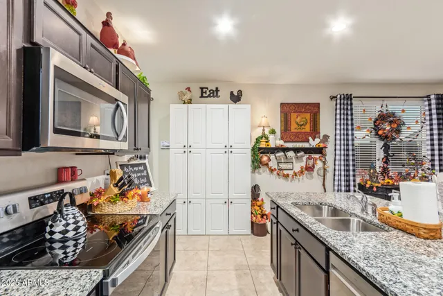 a kitchen with stainless steel appliances granite countertop a stove and a sink
