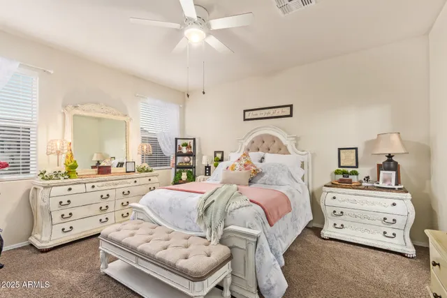 a bedroom with a bed and a dresser