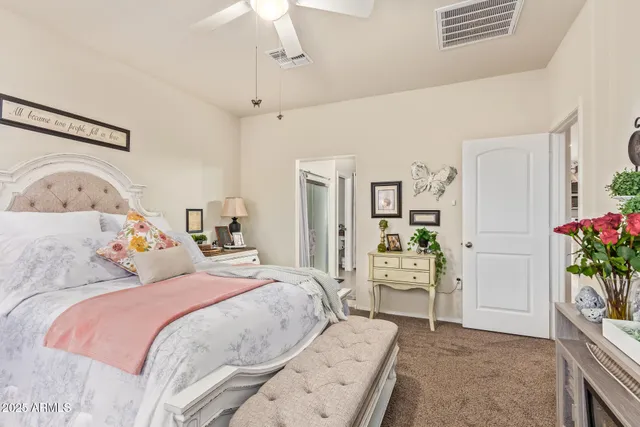 a bedroom with a bed and a couch