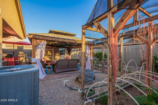 a view of a house with a bed and chair