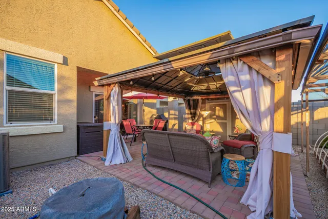 a outdoor space with patio the couches and a umbrella