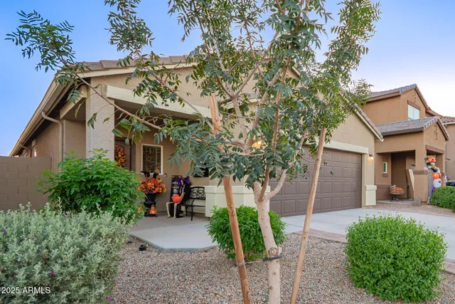 a front view of a house with garden