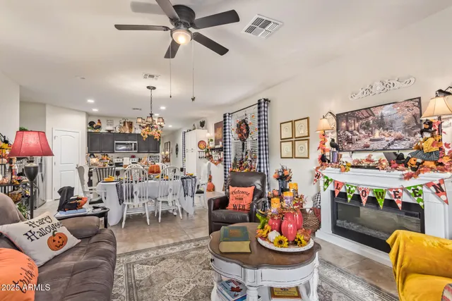 a living room with lots of furniture and white walls