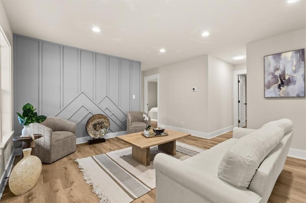 4203 Annistown Road Snellville, GA 30039 - Photo 15 of 32 a living room with furniture and a table