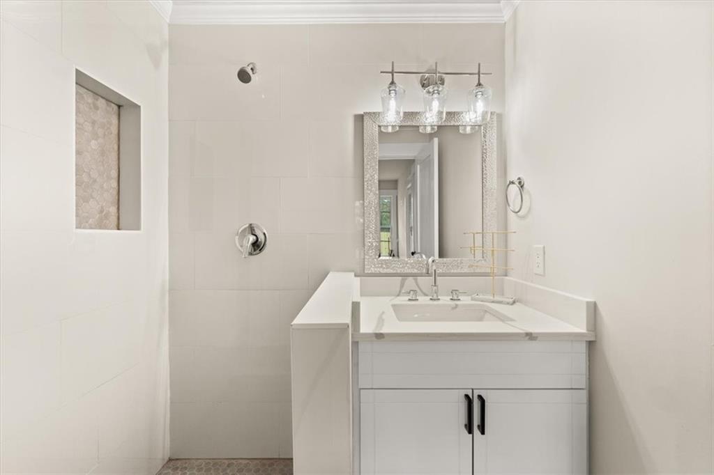 4203 Annistown Road Snellville, GA 30039 - Photo 19 of 32 a bathroom with a sink and a mirror