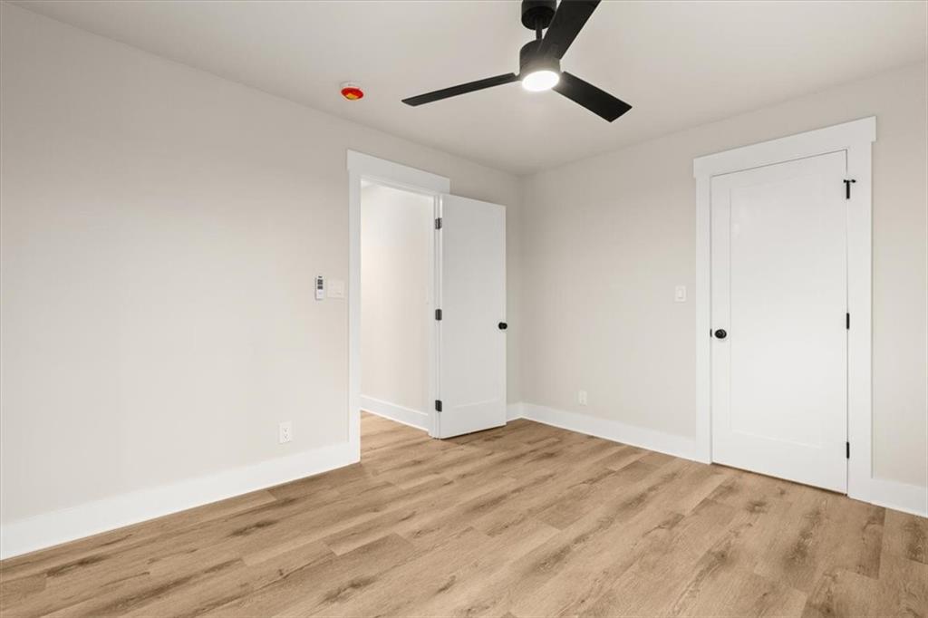 4203 Annistown Road Snellville, GA 30039 - Photo 20 of 32 a view of empty room with wooden floor