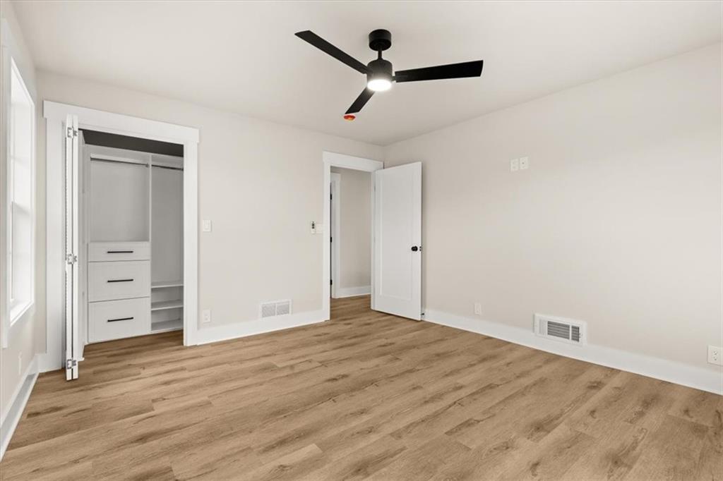 4203 Annistown Road Snellville, GA 30039 - Photo 22 of 32 wooden floor in an empty room