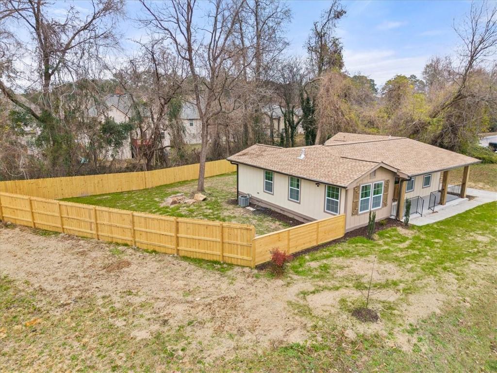 4203 Annistown Road Snellville, GA 30039 - Photo 30 of 32 a view of a house with backyard and trees