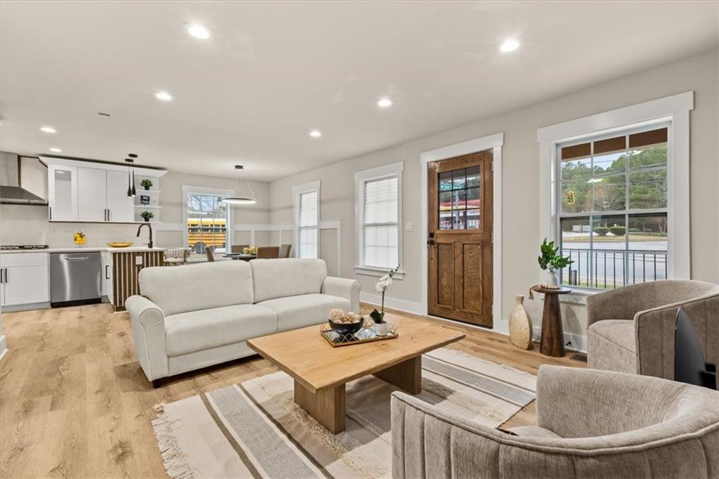 4203 Annistown Road Snellville, GA 30039 - Photo 3 of 32 a living room with furniture and a table