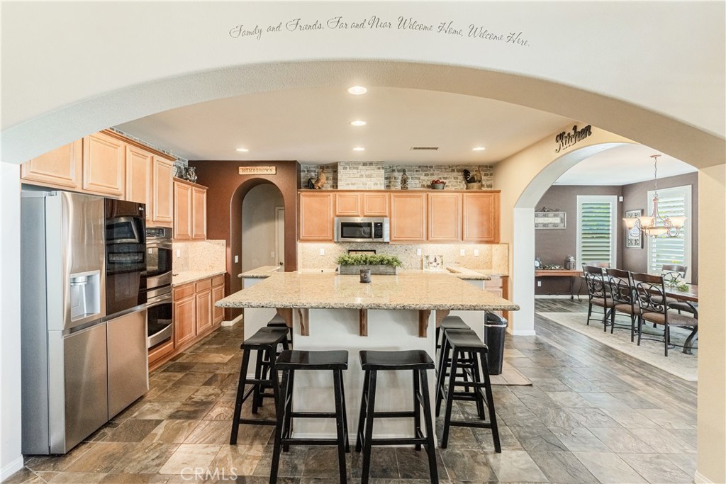 32016 Woodside Court Temecula, CA 92592 - Photo 12 of 40 a view of a dining room with furniture window and wooden floor