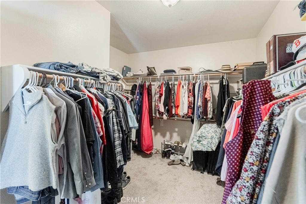 32016 Woodside Court Temecula, CA 92592 - Photo 22 of 40 a view of walk in closet with clothes