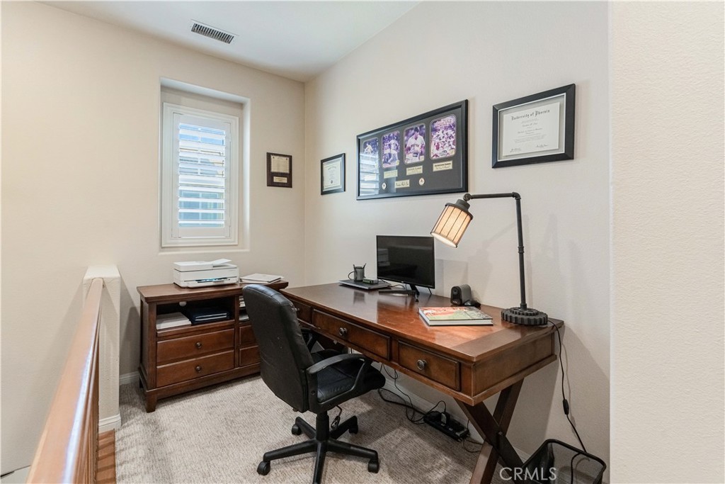 32016 Woodside Court Temecula, CA 92592 - Photo 23 of 40 a view of a workspace with furniture and a window