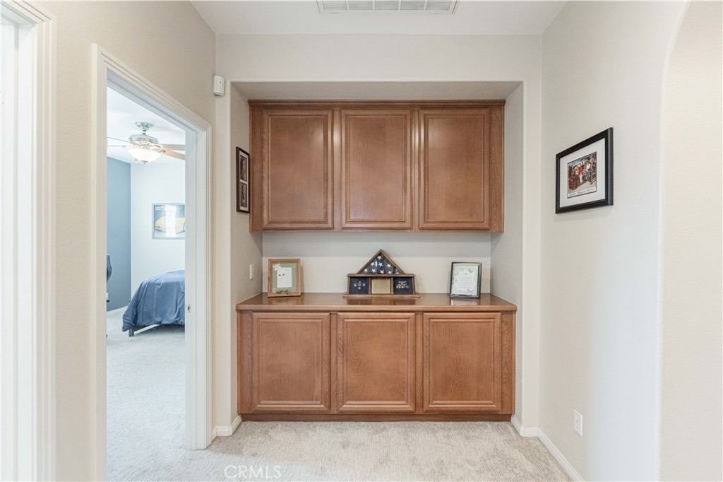 32016 Woodside Court Temecula, CA 92592 - Photo 26 of 40 a kitchen with a cabinets and window