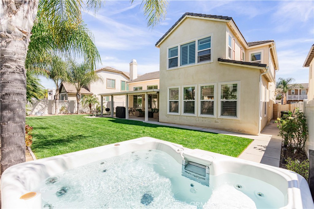 32016 Woodside Court Temecula, CA 92592 - Photo 29 of 40 a view of an house with backyard and swimming pool