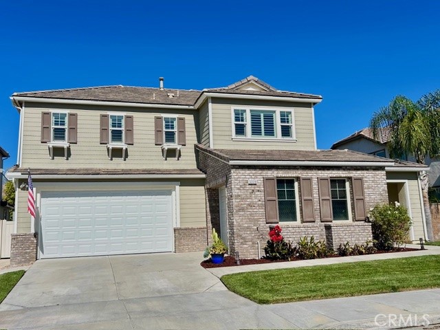 32016 Woodside Court Temecula, CA 92592 - Photo 3 of 40 a front view of a house with a yard and potted plants