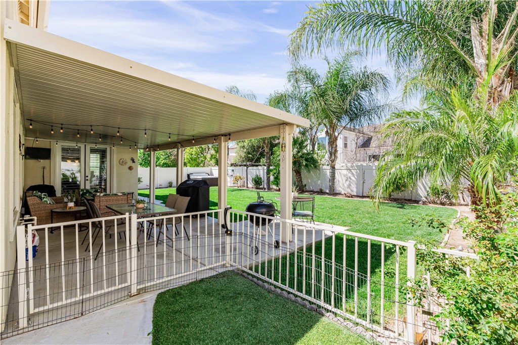 32016 Woodside Court Temecula, CA 92592 - Photo 34 of 40 a view of a house with a wooden deck and a garden