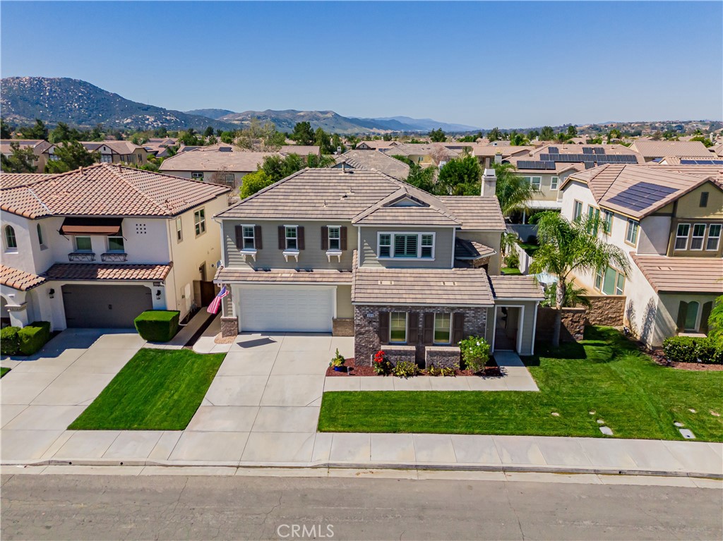 32016 Woodside Court Temecula, CA 92592 - Photo 5 of 40 an aerial view of a house with a yard table and chairs