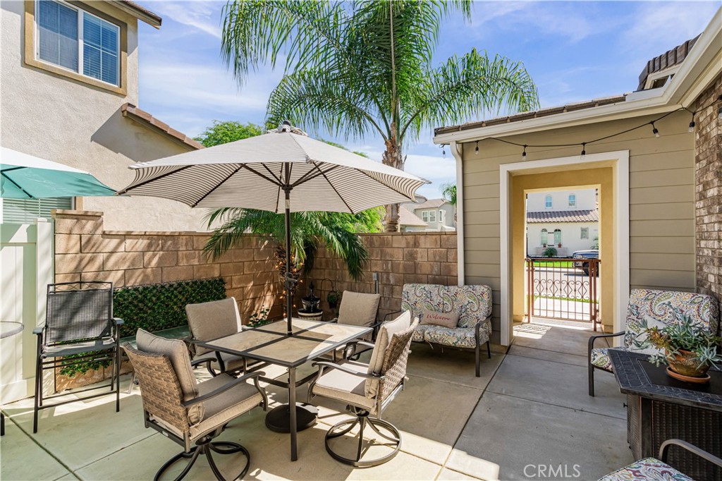 32016 Woodside Court Temecula, CA 92592 - Photo 7 of 40 a patio with a patio table and chairs