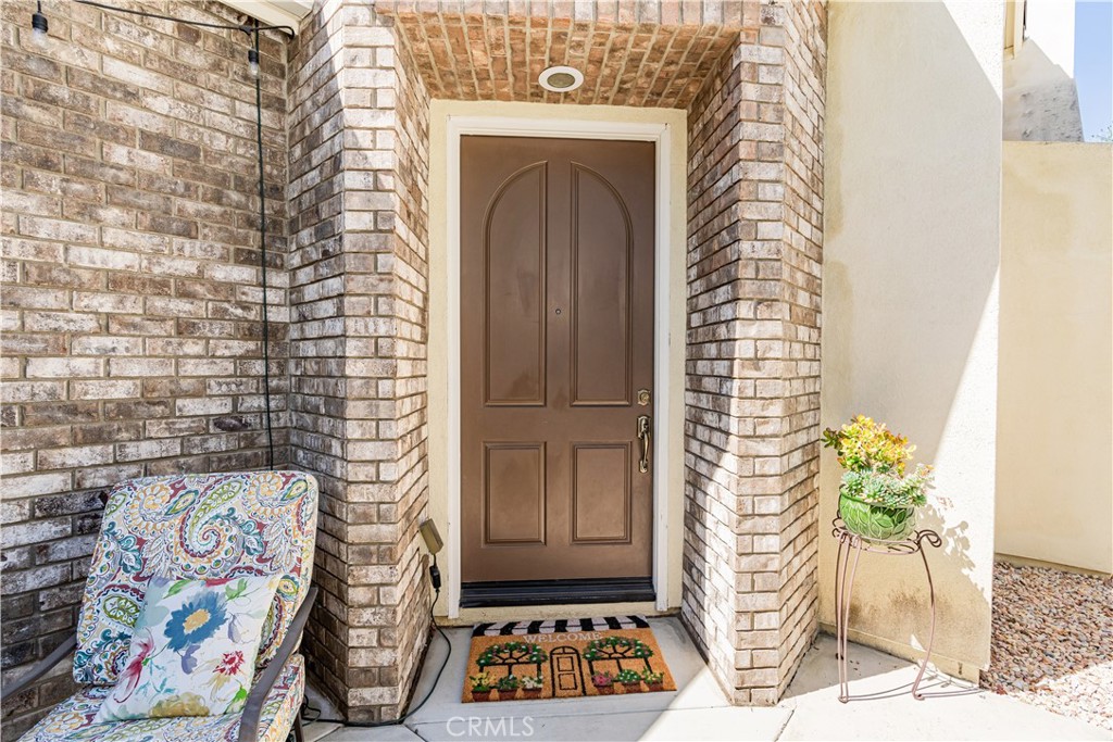 32016 Woodside Court Temecula, CA 92592 - Photo 8 of 40 a door with window and a potted plant