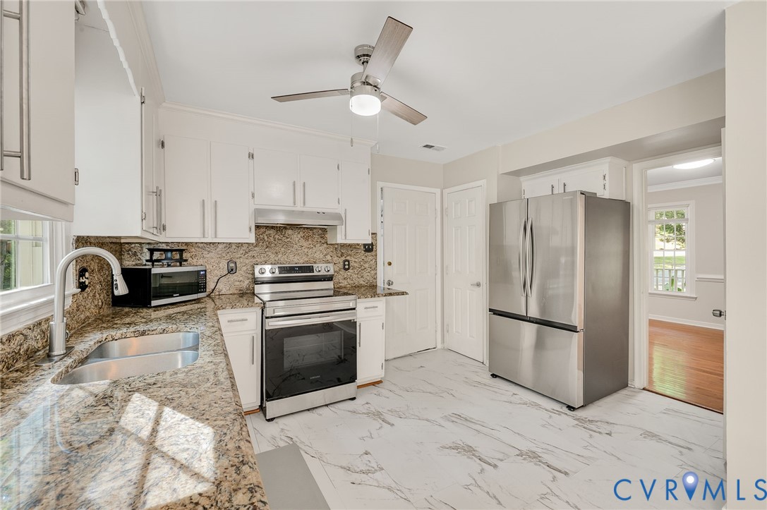 4820 Cedar Cliff Road Chester, VA 23831 - Photo 15 of 41 White cabinetry and granite countertops with a mat