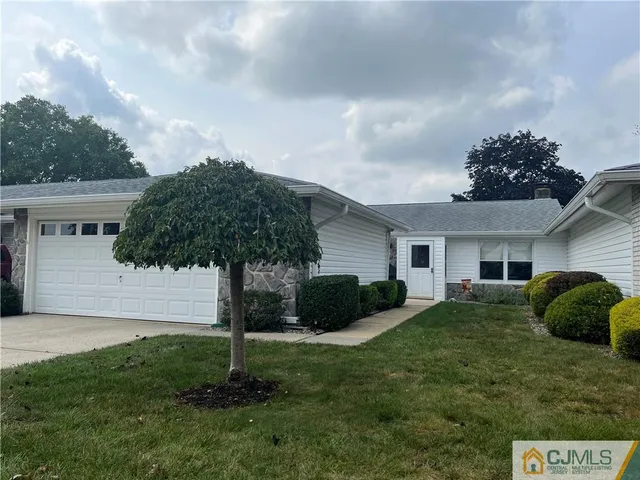 a house view with a garden space