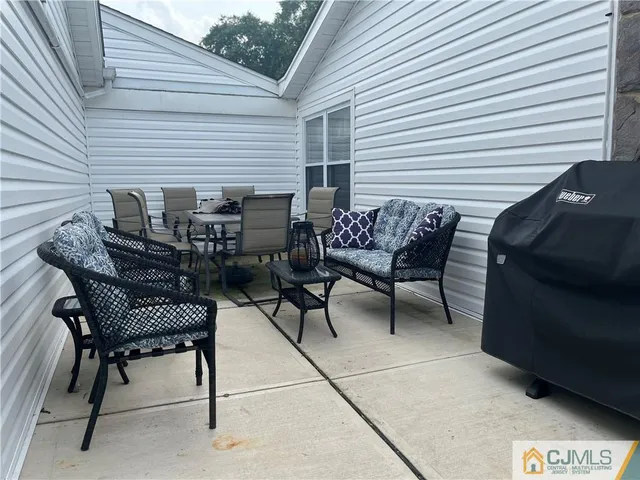 a view of a two chairs in the back