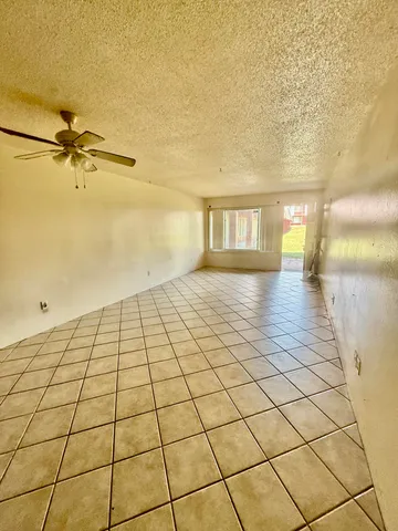 a kitchen with stainless steel appliances granite countertop a stove a refrigerator and a sink